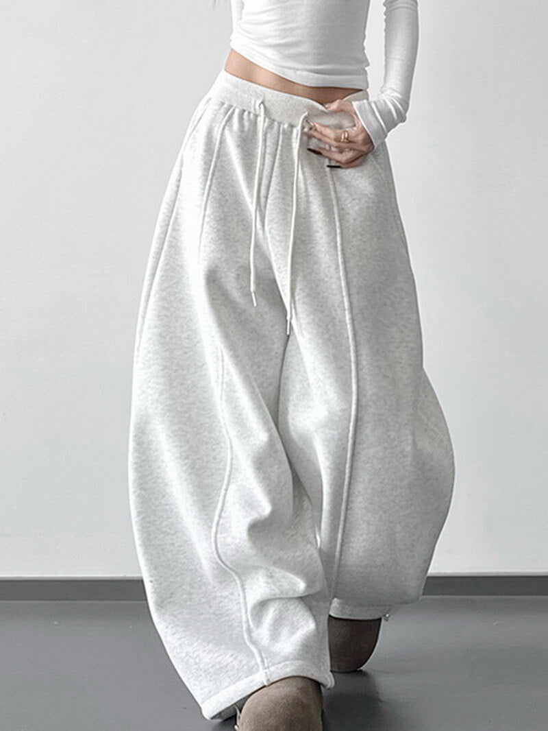 NURO Women's High Waist Flared Sweatpants - Pink Wide Leg Lounge Pants with Asymmetric Hem