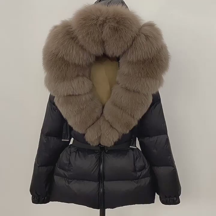 Load video: NURO Women's Elegant Belted Fox Fur Hooded Down Jacket - Luxury Slim Fit Long Puffer Coat