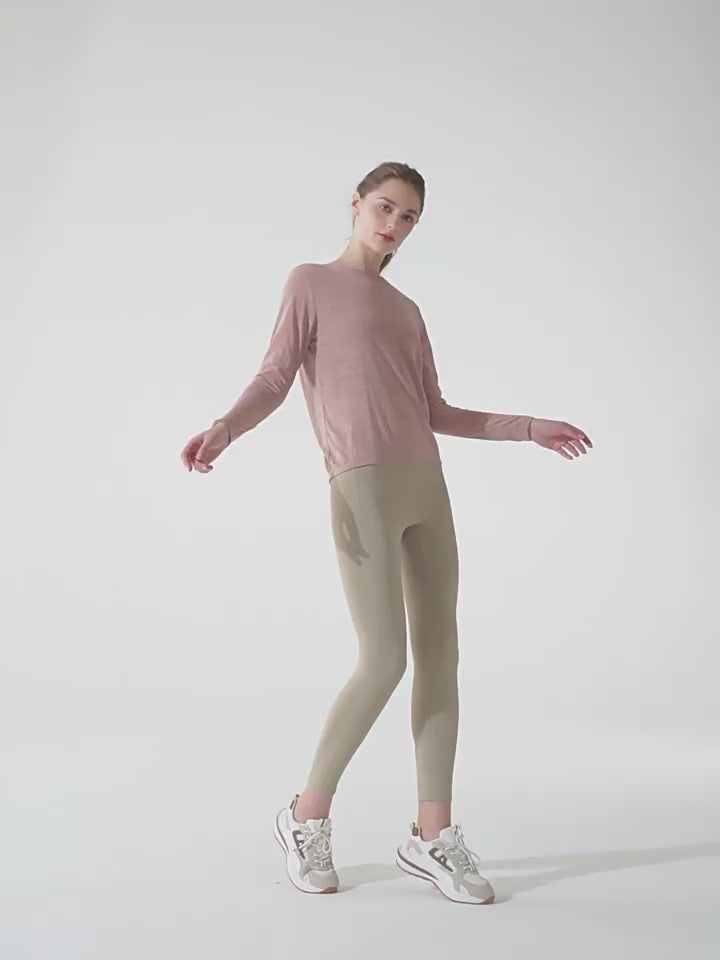 Load video: NURO Women's Long Sleeve Quick-Dry Workout Tee