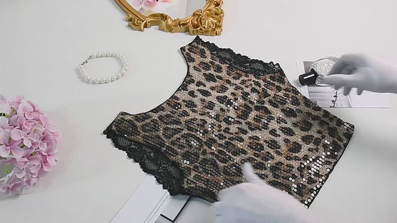 Load video: NURO Women's Leopard Print Sequin Lace Crop Top - Halter Neck, Mesh Panel, Bodycon Fit, Sexy Clubwear