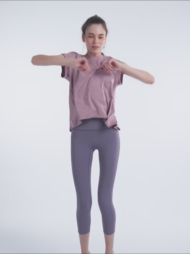 Load video: NURO Women's Quick-Dry Short Sleeve Workout Tee