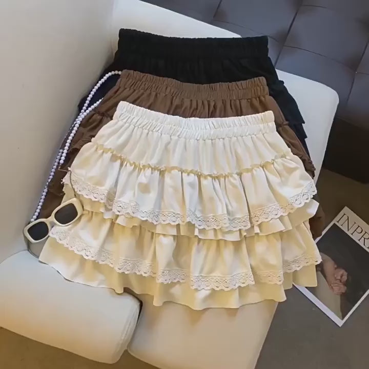 Load video: NURO Women's Layered Tiered Cake Skirt with Elastic Waist - Casual Stretch A-Line Mini Skirt, Retro Tiered Midi Skirt